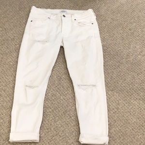 A gold e cropped white jean
